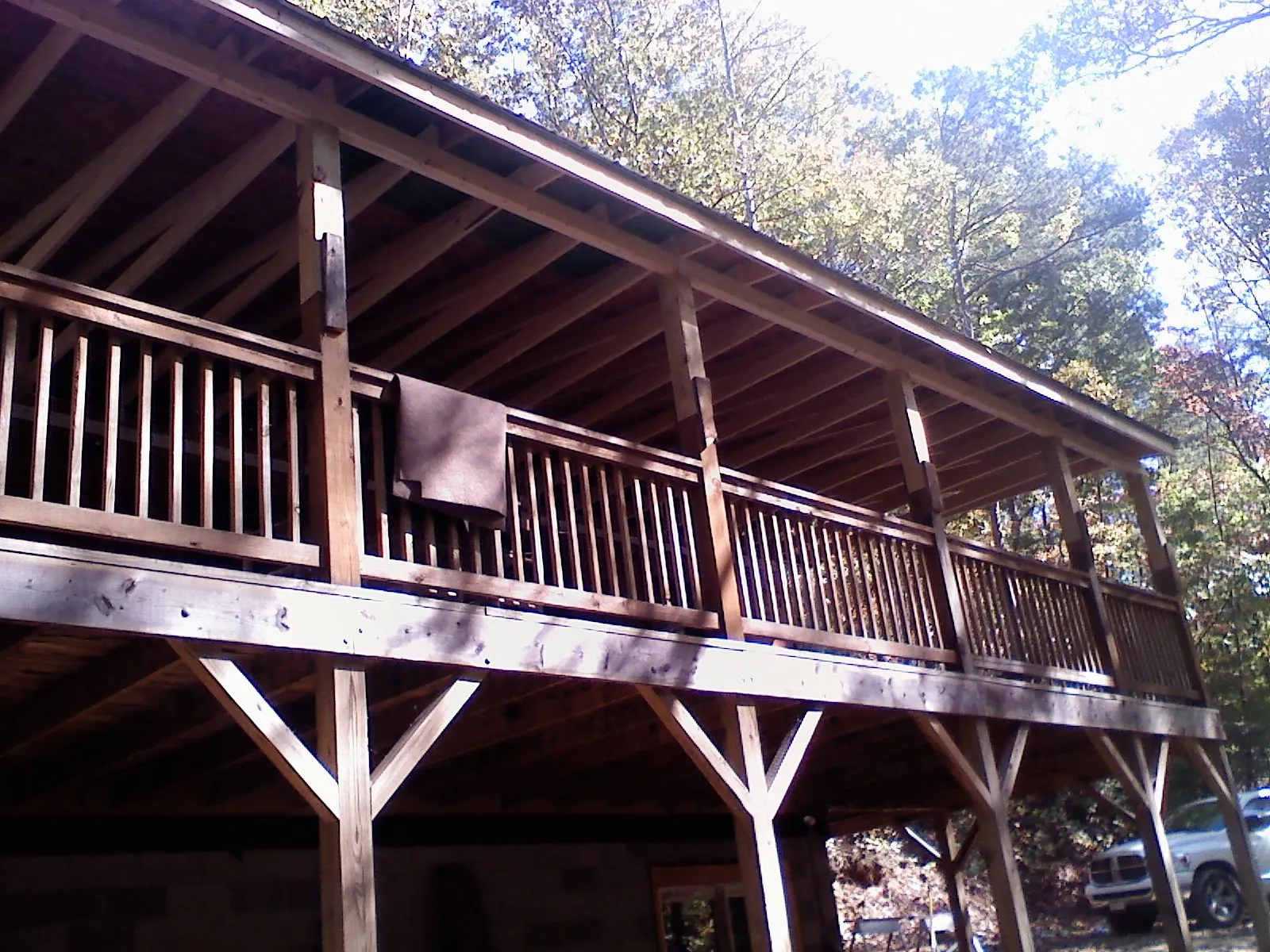 Timber framing under a new elevated porch and deck — Roof Leak Repair in Pembroke Township by Roofing Brothers